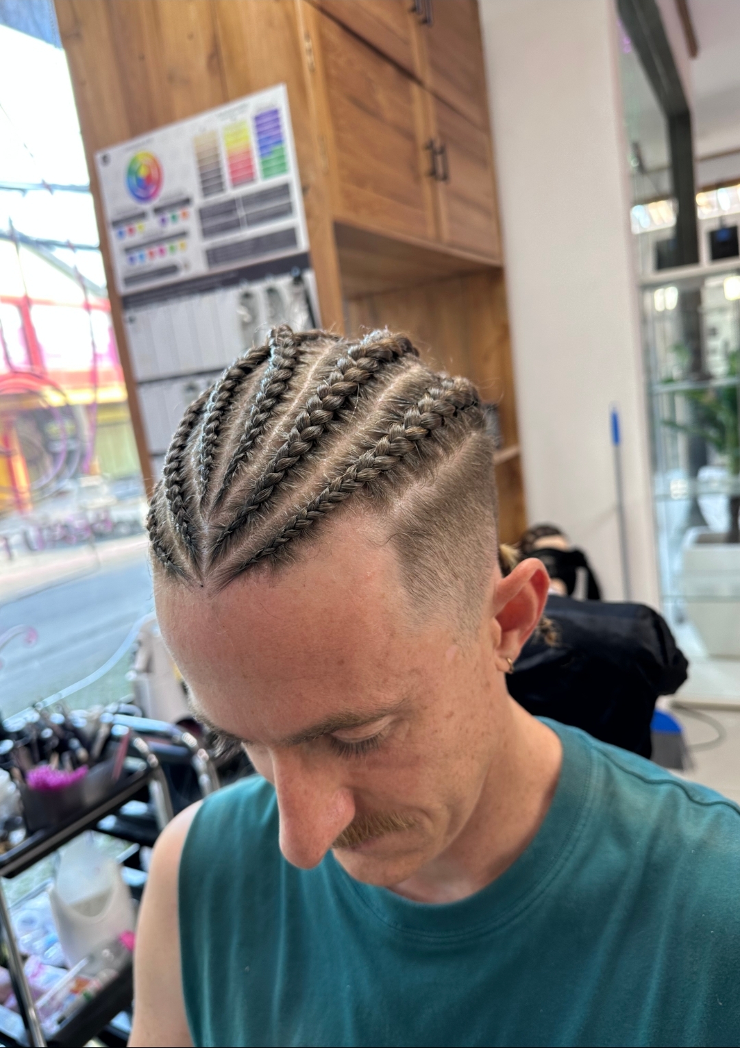 Cornrows with fade haircut on male client — braids and fade combo