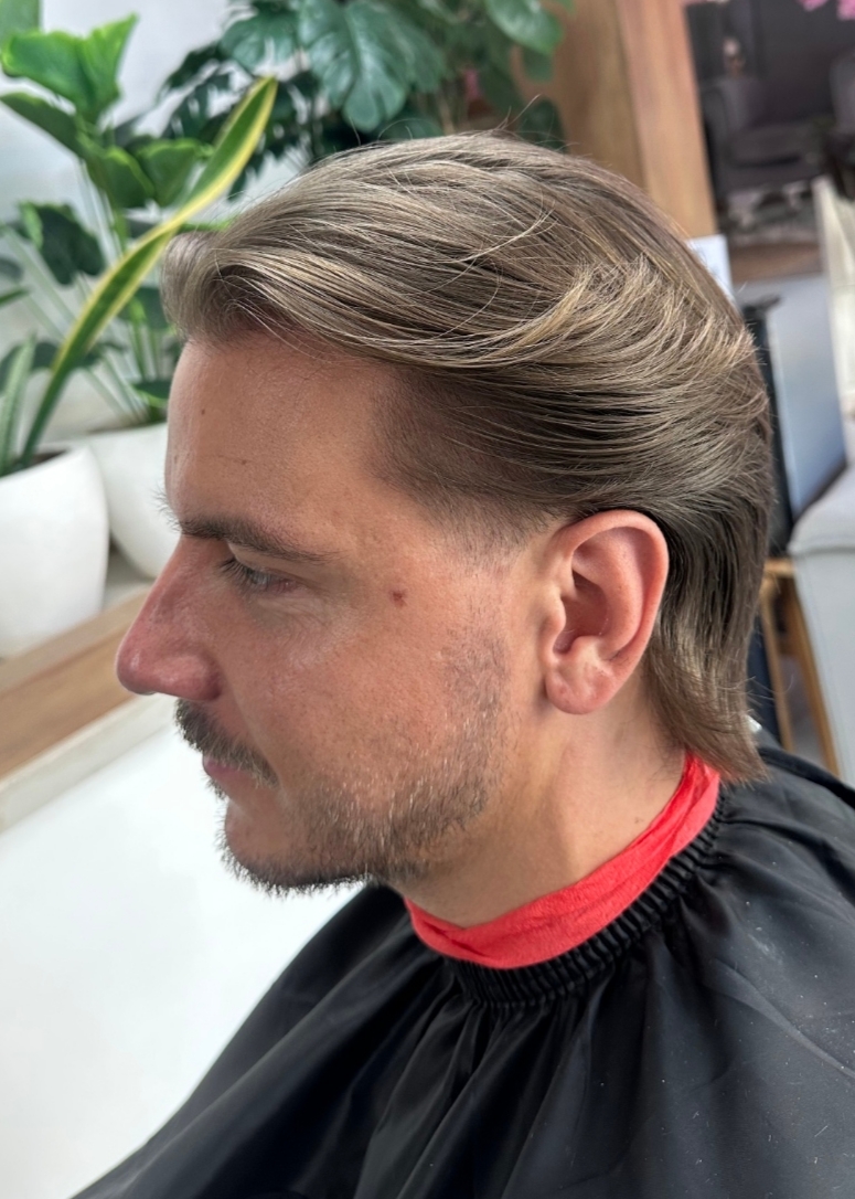 Slicked back haircut — premium styled haircut result